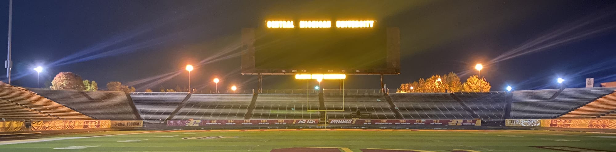 empty football stadium at night under the lights Lubbock