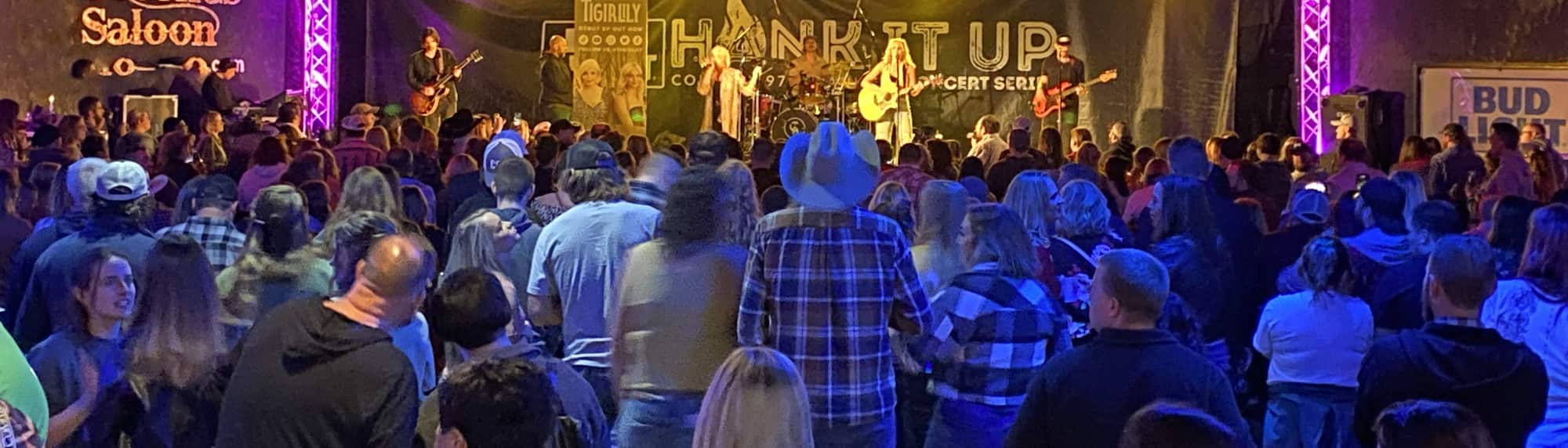 country concert with fans wearing cowboy hats Lubbock